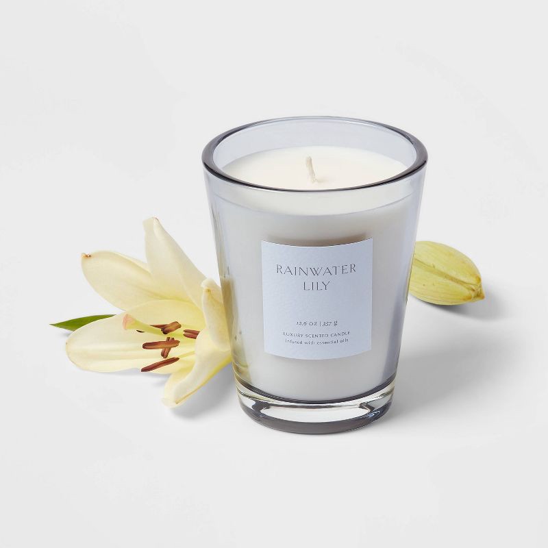 slide 3 of 5, 12.6oz Rainwater Lily & Peach Scented Candle with Glass Vase & Dustcover - Threshold™: Palm Wax, 52hr Burn Time, 12.6 oz
