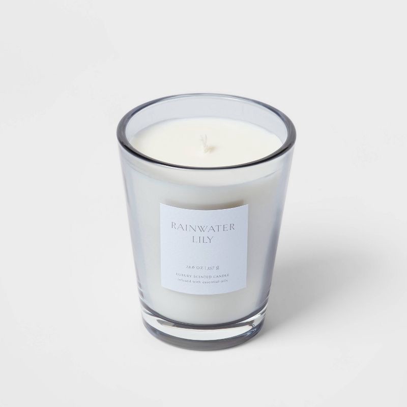 slide 4 of 5, 12.6oz Rainwater Lily & Peach Scented Candle with Glass Vase & Dustcover - Threshold™: Palm Wax, 52hr Burn Time, 12.6 oz