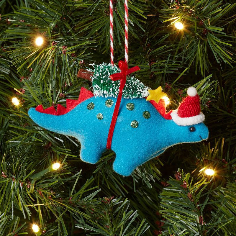 slide 2 of 3, Fabric Stegosaurus with Tree Christmas Tree Ornament Blue - Wondershop™, 1 ct