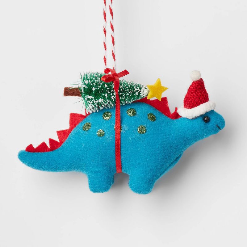 slide 1 of 3, Fabric Stegosaurus with Tree Christmas Tree Ornament Blue - Wondershop™, 1 ct