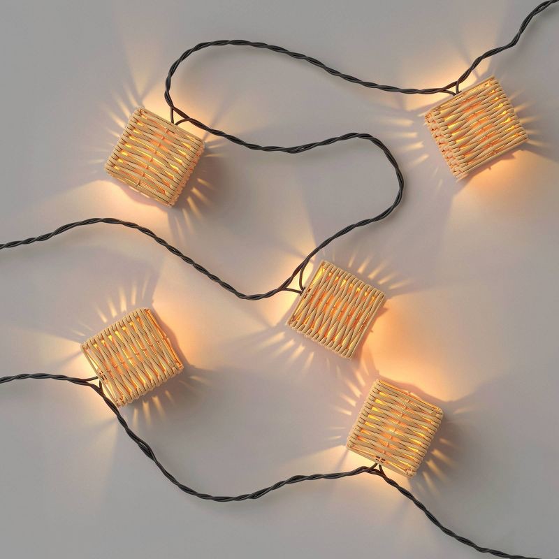 slide 3 of 4, 10ct LED Mini Woven Resin Wicker Indoor Outdoor Lantern String Lights Clear Bulbs with Black Wire - Threshold™, 10 ct