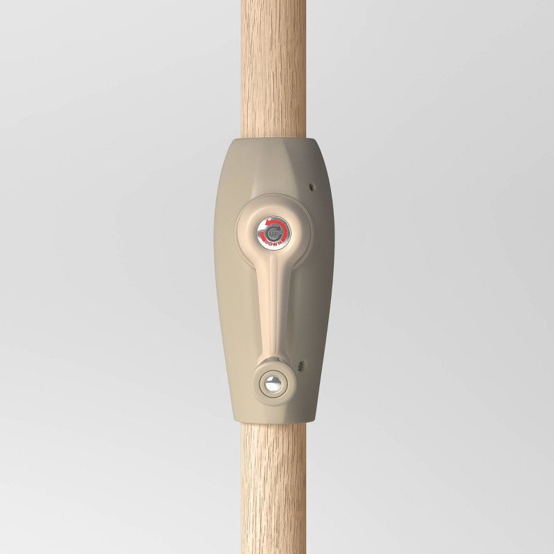 slide 4 of 6, 9' Round Dashed Lines Outdoor Patio Market Umbrella with Faux Wood Pole - Threshold™: Fade-Resistant, Crank Tilt, 1 ct