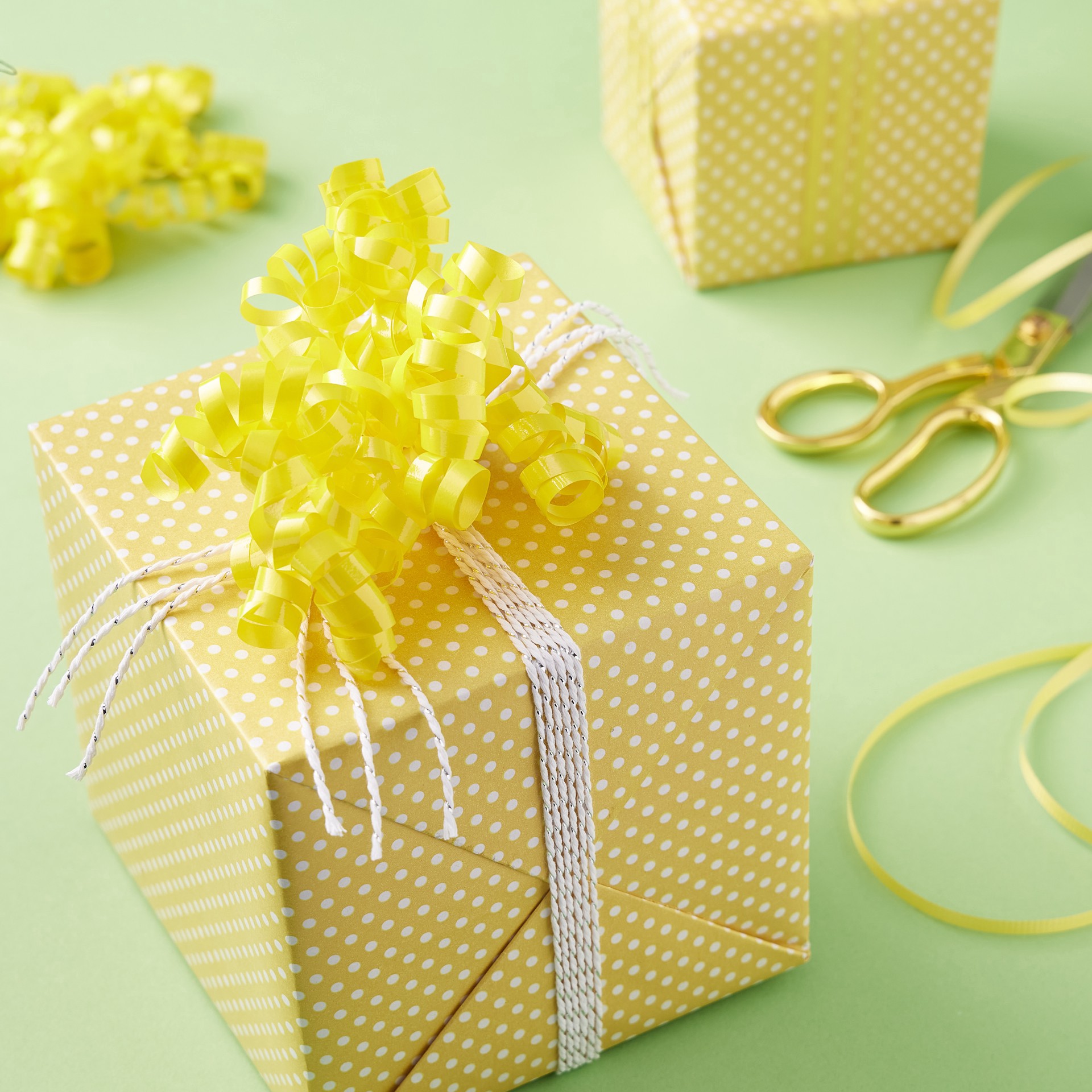 slide 3 of 3, 30" Yellow Twisty Bows By Celebrate It, 2ct., 2 ct