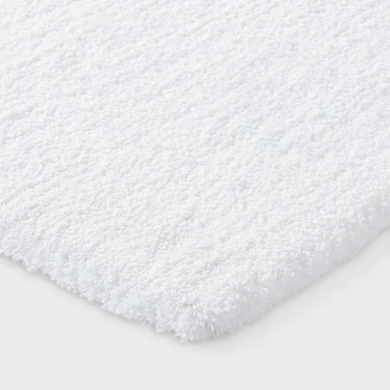 slide 3 of 4, 24"x60" Spa Plush Bath Rug White - Threshold™, 1 ct