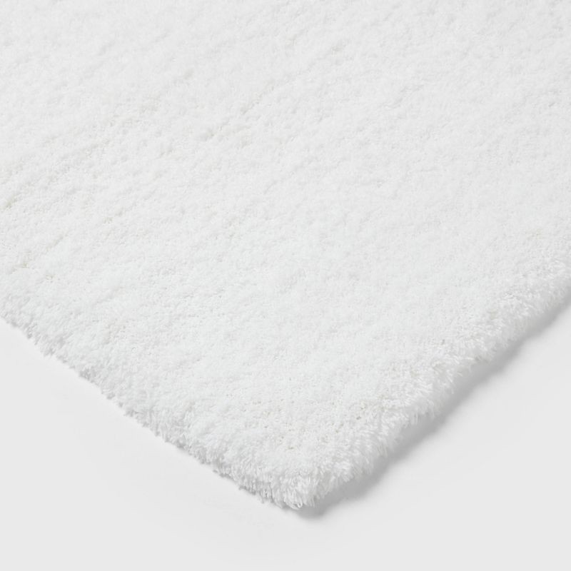 slide 3 of 4, 24"x40" Spa Plush Bath Rug White - Threshold™: Machine Washable, Tufted Polyester, Latex Backing, 1 ct