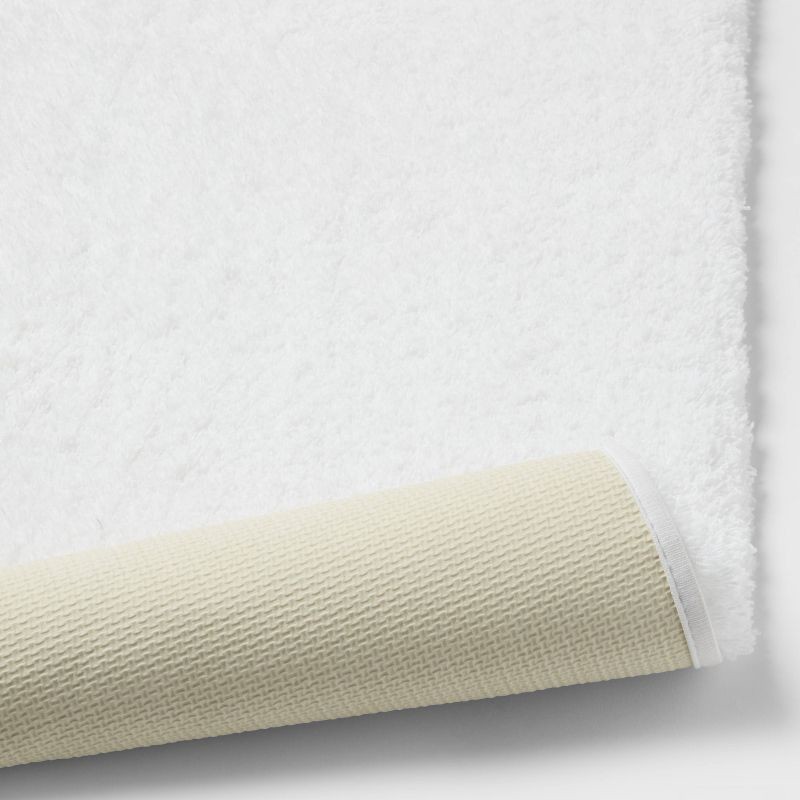 slide 4 of 4, 24"x40" Spa Plush Bath Rug White - Threshold™: Machine Washable, Tufted Polyester, Latex Backing, 1 ct