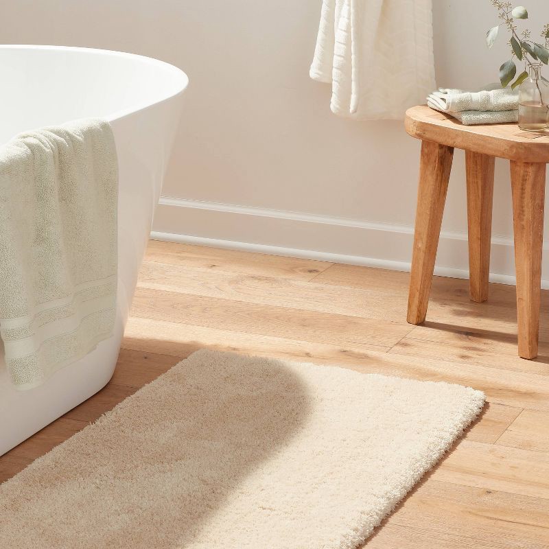 slide 2 of 4, 24"x40" Spa Plush Bath Rug Almond - Threshold™, 1 ct