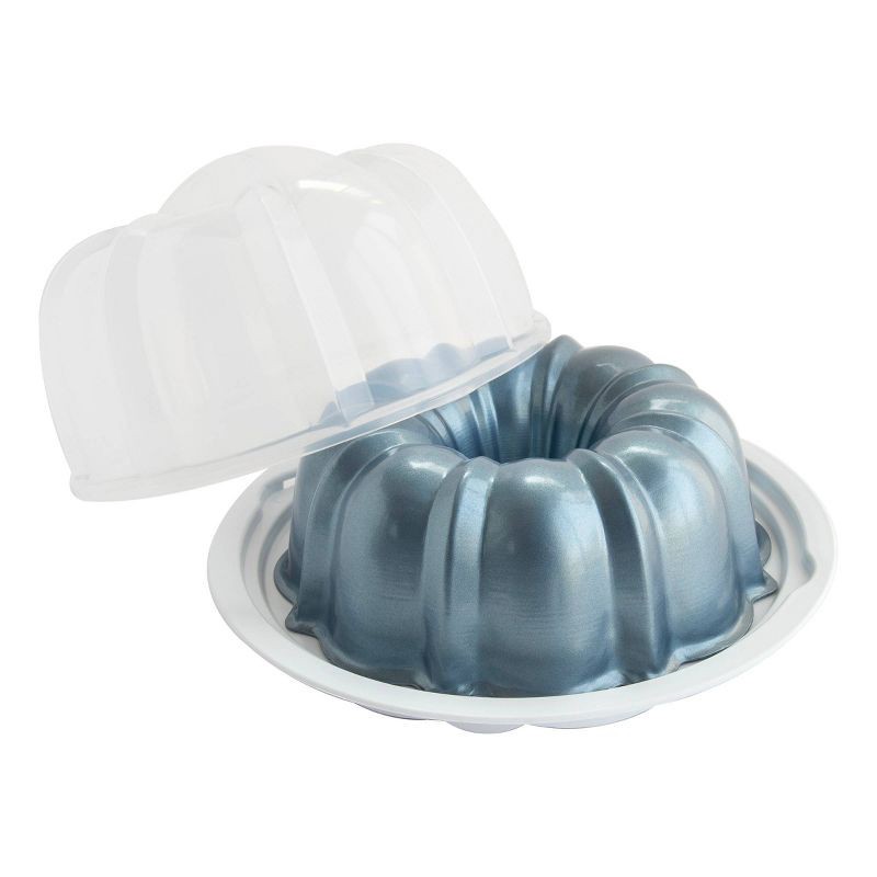 slide 3 of 7, Nordic Ware 12 Cup Formed Aluminum Bundt Pan Blue with Cake Keeper: Nonstick Baking Pan, Dishwasher-Safe, 10-Year Warranty, 1 ct
