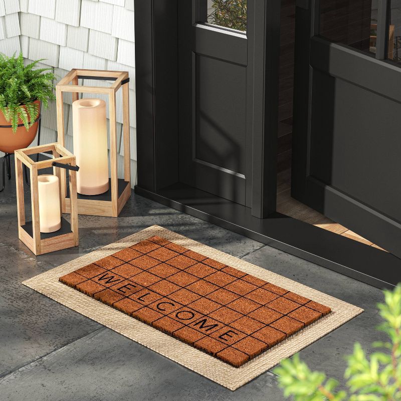 slide 2 of 4, 1'4"x2'4" Welcome Grid Rectangular Outdoor Door Mat Blue - Room Essentials™, 1 ct