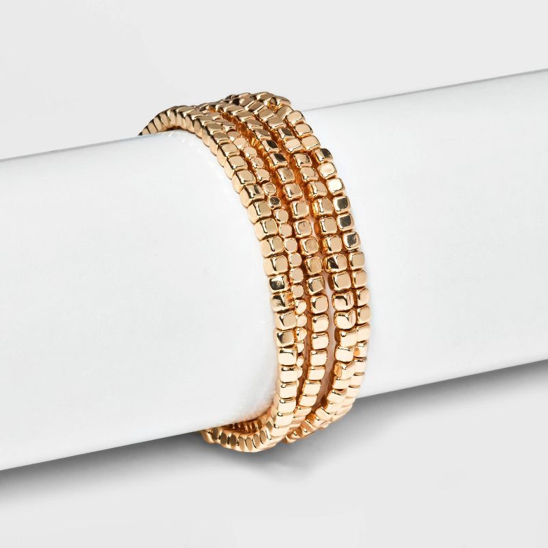 slide 2 of 4, Beaded Stretch Bracelet Set 5pc - Universal Thread™ Gold: Recycled Brass, One Size, Beaded & Stretch Design, 5 ct