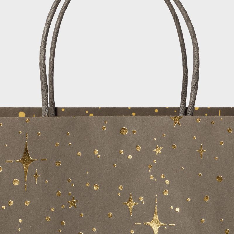 slide 3 of 3, XL Foil Print Stars Gift Bag Black/Gold - Spritz™: Large Paper Bag for All Occasions, 19.25" x 16" x 6", 1 ct