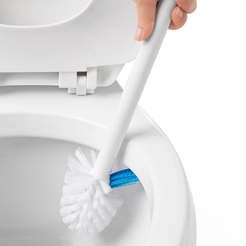 slide 5 of 7, OXO Toilet Brush with Rim Cleaner and Canister: Durable Plastic, Bathroom Cleaning Accessory, 1 ct