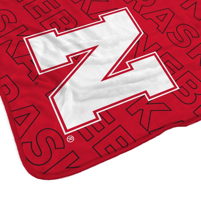 slide 2 of 3, NCAA Nebraska Cornhuskers Wordmark 60 x 70 Faux Shearling Blanket, 1 ct