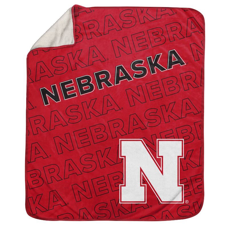 slide 1 of 3, NCAA Nebraska Cornhuskers Wordmark 60 x 70 Faux Shearling Blanket, 1 ct