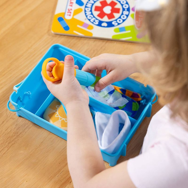 slide 8 of 9, Melissa & Doug Boo-Boos & Bandages Reusable First Aid Pretend Play Set: Creativity Focus with Medical Accessories, 1 ct