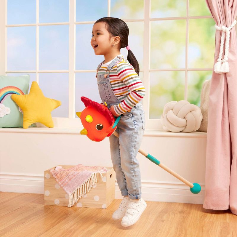 slide 3 of 9, B. toys Hop 'n' Ride Tommy Triceratops - Plush Dinosaur Hobbyhorse with Sounds, 1 ct