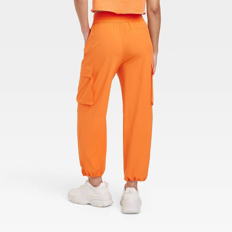 Women's Cinch Hem Woven Cargo Pants - JoyLab Orange L 1 ct