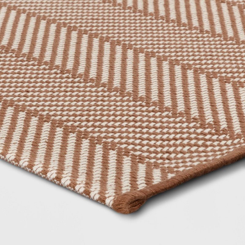 slide 3 of 4, 4'x5'6" Chevron Striped Area Rug Ivory/Tan - Room Essentials™, 1 ct