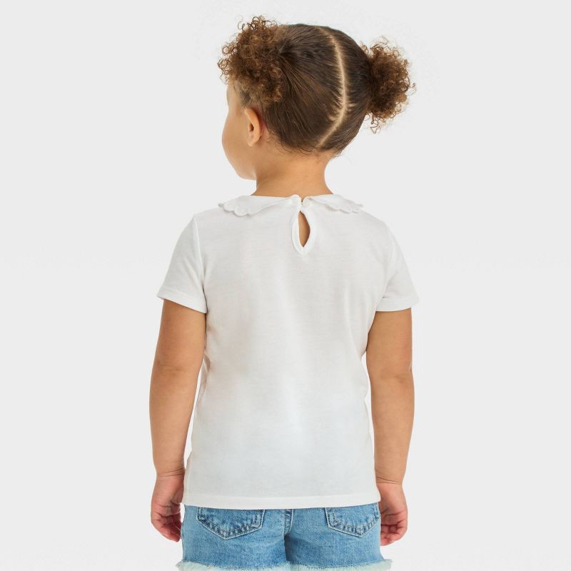 slide 2 of 4, OshKosh B'gosh Toddler Girls' Peter Pan Short Sleeve Top - White 12M: Cotton-Polyester Blend, Back Button, 1 ct
