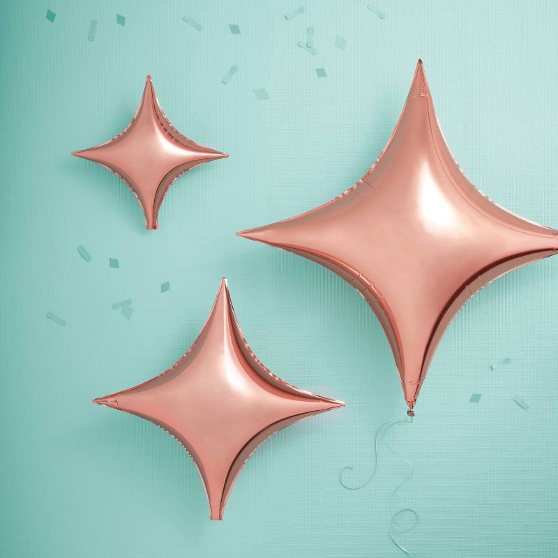 slide 2 of 7, 3ct Rose Gold Quadrangle Star Shaped Foil Balloons - Spritz™, 3 ct