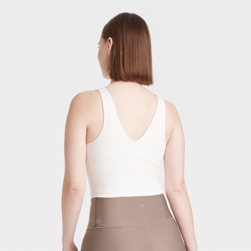 slide 4 of 6, Women's Flex Light Support V Neck Cropped Sports Bra - All In Motion™ Cream XS: Moisture Wicking, Quick Drying, 1 ct