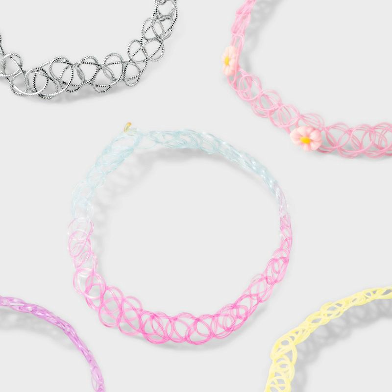 slide 3 of 8, Girls' 5pk Tattoo Choker Necklace Set - Cat & Jack™: Pull-On Closure, 4 Inch Extender, Acrylic Material, 11 Inch Length, 5 ct