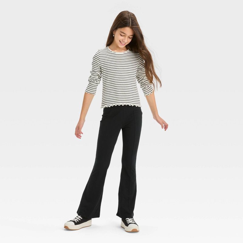 slide 3 of 3, Girls' Solid Flare Leggings - art class™ Black M: High Rise, Hidden Pocket, Midweight Jersey, 1 ct