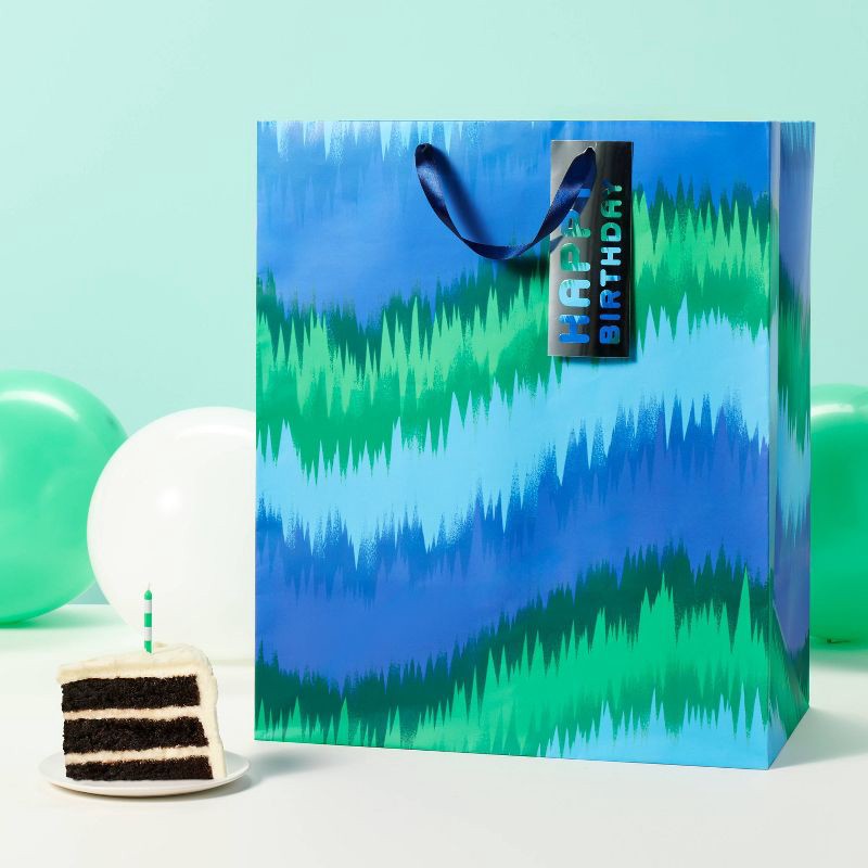 slide 2 of 3, XLarge Tie Dye Wave Birthday Gift Bag with Tag Blue/Green - Spritz™, 1 ct