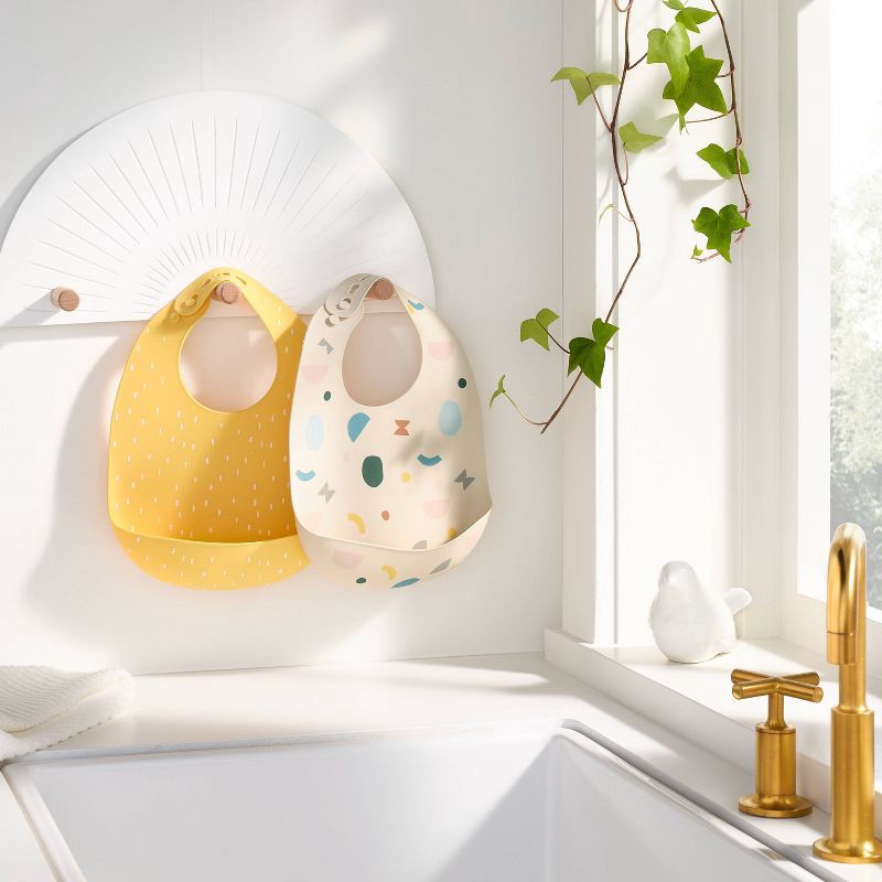 slide 2 of 4, Silicone Bibs - 2pk - Shapes/Yellow - Cloud Island™, 2 ct