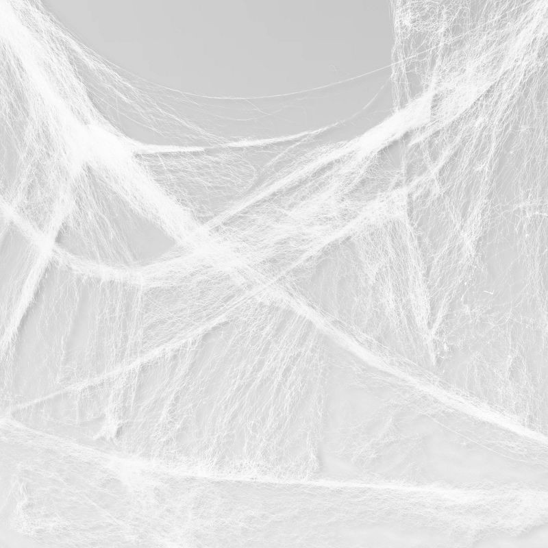 slide 3 of 3, 11' Stretchy Spiderweb Halloween Decorative Prop Glow in the Dark - Hyde and EEK! Boutique™, 1 ct