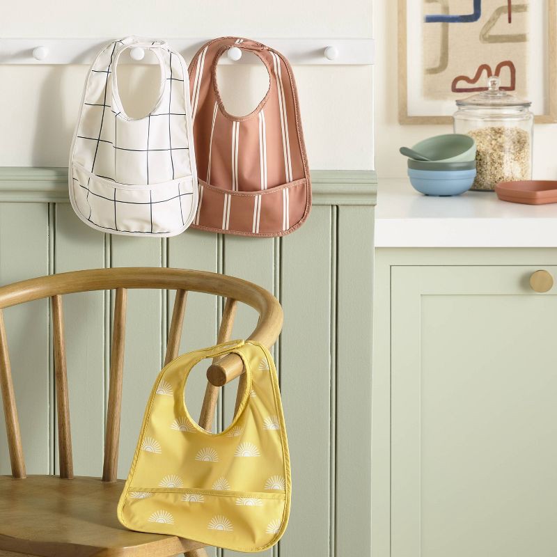 slide 2 of 4, Water-Resistant Bibs - 3pk - Suns/Stripe - Cloud Island™, 3 ct