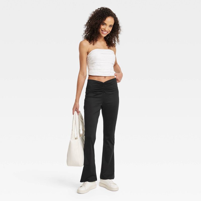 slide 3 of 3, Women's High Waisted Flare Leggings with Ruched Waistband - A New Day™ Black M: Midweight Stretch Jersey, 1 ct