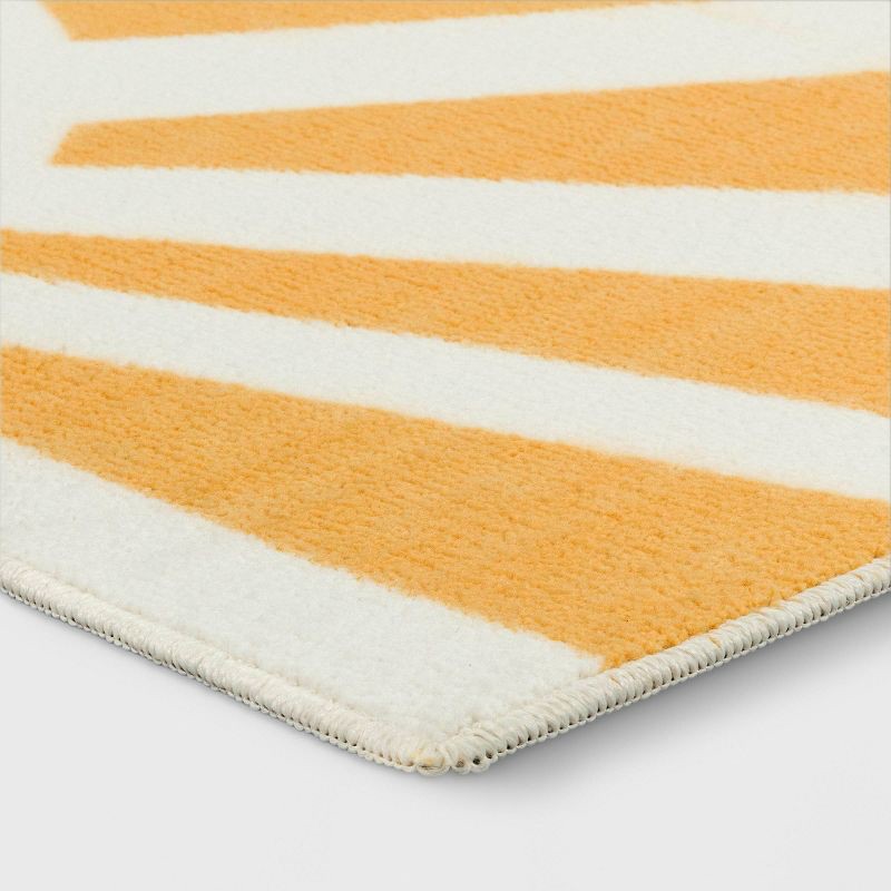 slide 3 of 4, 4'x5'6" Washable Hello Sunshine Printed Area Rug Yellow - Room Essentials™, 1 ct