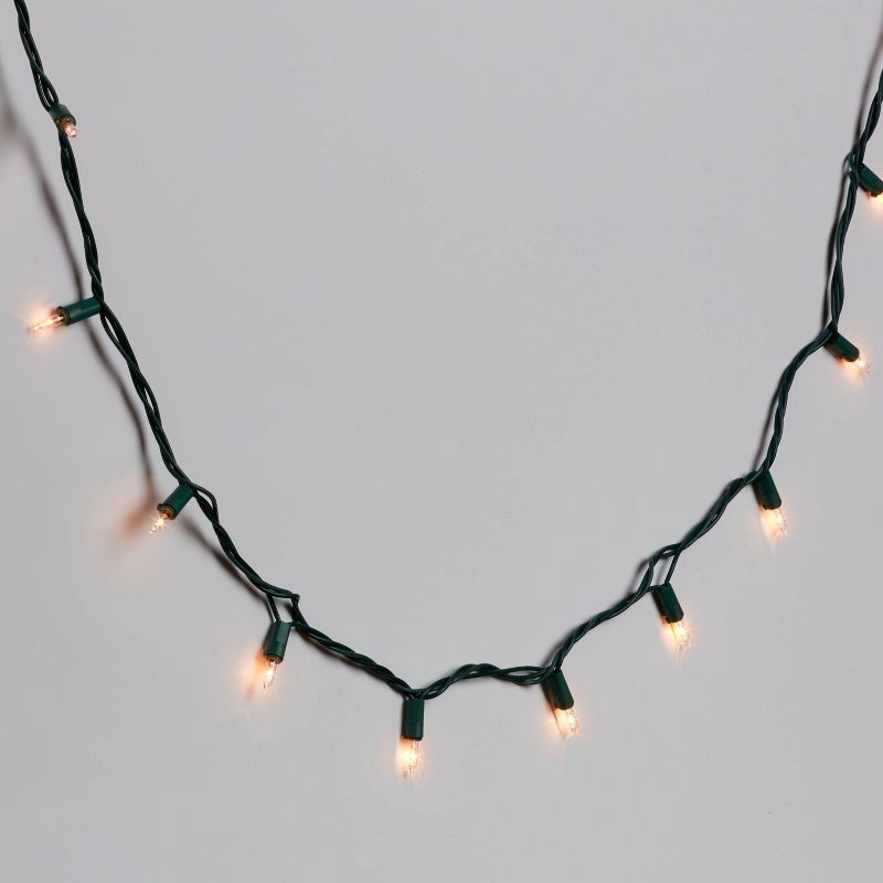 slide 1 of 5, 200ct Incandescent Heavy Duty Christmas Indoor Outdoor Mini String Lights Clear with Green Wire - Wondershop™, 200 ct