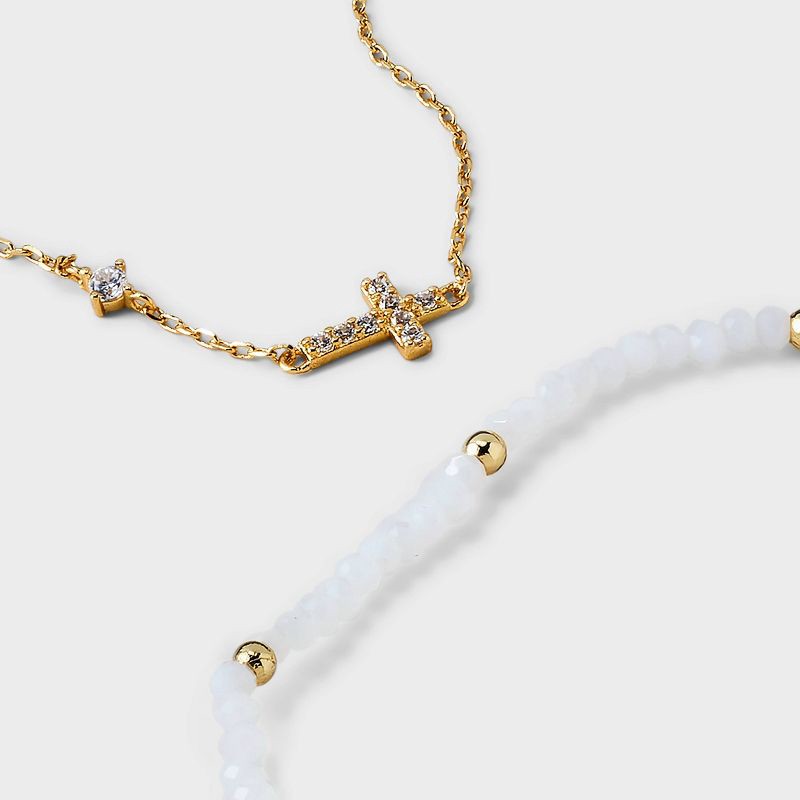 slide 4 of 4, 14k Gold Dipped Cubic Zirconia Cross on Chain and Crystal Stretch Bracelet Set 2pc - Gold/White: Nickel-Free, Lobster Claw Clasp, 2 ct