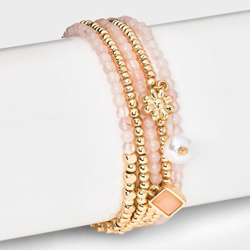 slide 2 of 4, Beaded Stretch Charm Bracelet w Semi Precious Rose Quartz Set 5pc - Universal Thread™ Gold/Pink: Multicolored Stretch Band, Recycled Zinc, 5 ct
