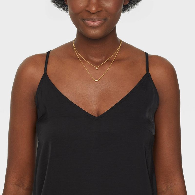 slide 2 of 4, 14k Gold Plated Triple Cubic Zirconia Layered Necklace - A New Day™ Gold: Lobster Claw Clasp, 16" Length, 1 ct