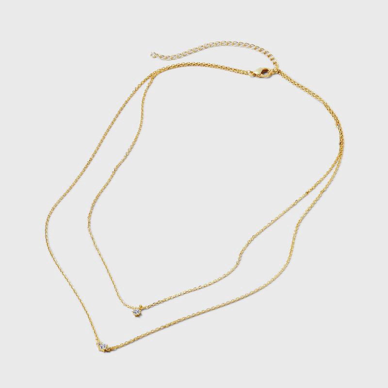 slide 3 of 4, 14k Gold Plated Triple Cubic Zirconia Layered Necklace - A New Day™ Gold: Lobster Claw Clasp, 16" Length, 1 ct