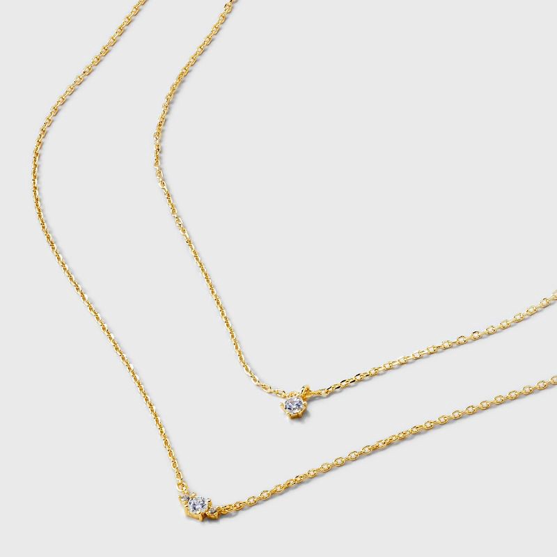 slide 4 of 4, 14k Gold Plated Triple Cubic Zirconia Layered Necklace - A New Day™ Gold: Lobster Claw Clasp, 16" Length, 1 ct