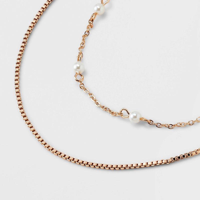 slide 4 of 4, Gold 2 Row Clear Stone Pearl Ball Necklace - A New Day™ Gold: Boxed Chain, Lobster Claw Clasp, 17" Length, 3" Extender, 1 ct