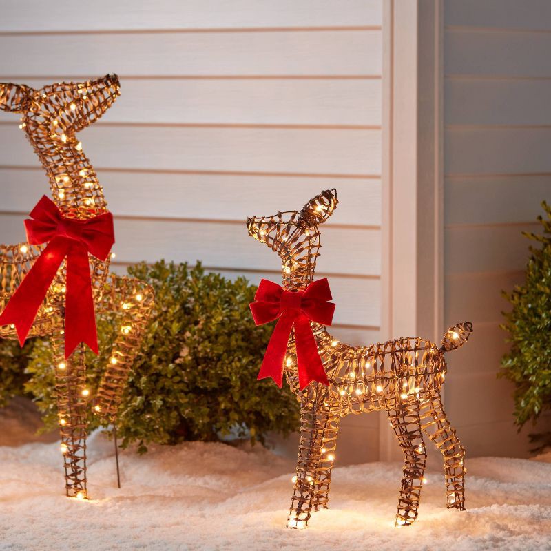 slide 2 of 4, 24" LED Faux Rattan Deer Fawn with Red Bow Christmas Novelty Sculpture Light - Wondershop™, 1 ct