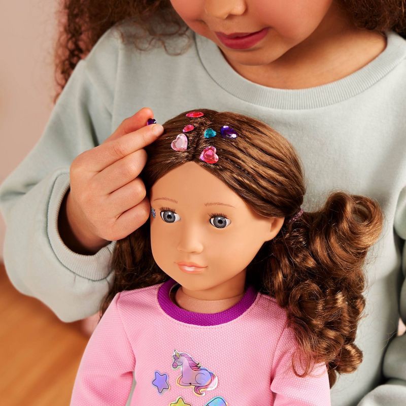 slide 2 of 7, Our Generation Finley 18" Doll with 50+ Stickers & Sticker Book Set: Fashion and Beauty, Light Brown Hair, Purple Eyes, 1 ct