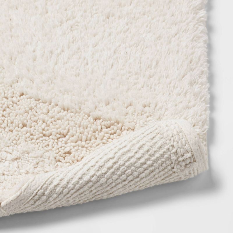 slide 4 of 4, 18"x32" Half Moon Bath Rug with Tassels Cream - Threshold™, 1 ct