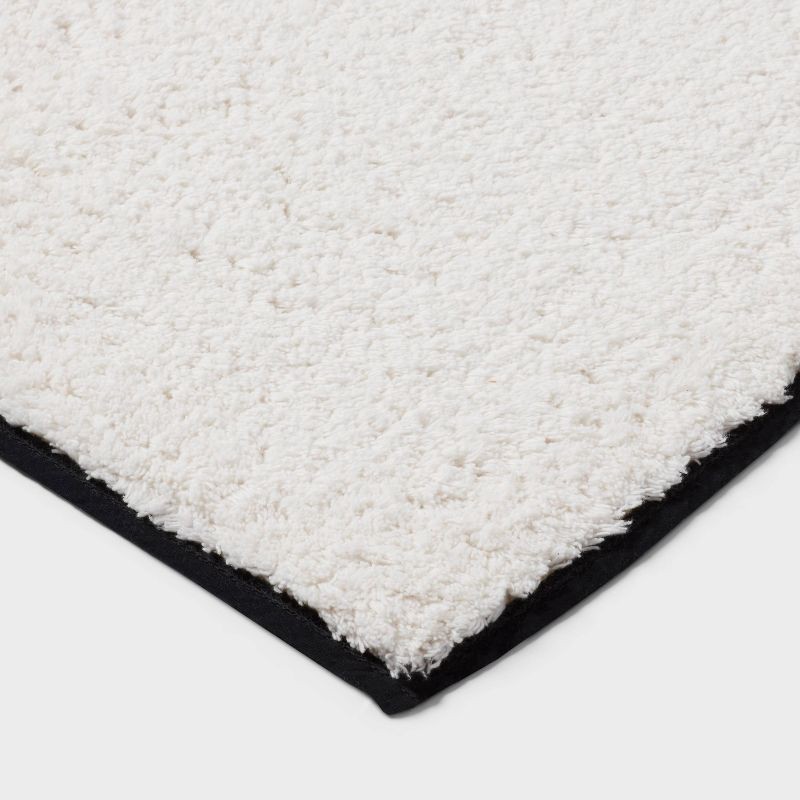 slide 3 of 4, 24"x36" Oversized Border Bath Rug Black/White - Threshold™, 1 ct