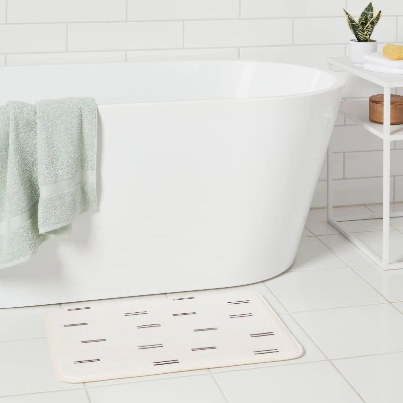 slide 2 of 4, 17"x24" Double Dash Flannel Cushion Bath Rug - Room Essentials™, 1 ct