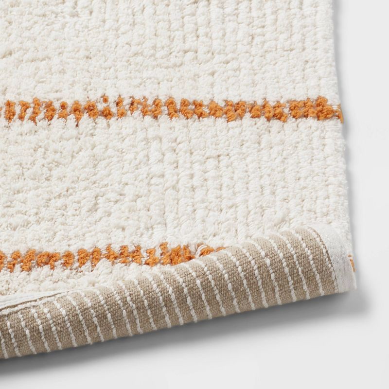 slide 4 of 4, 20"x30" Modern Tufted Stripe Bath Rug Yellow/Cream - Threshold™, 1 ct