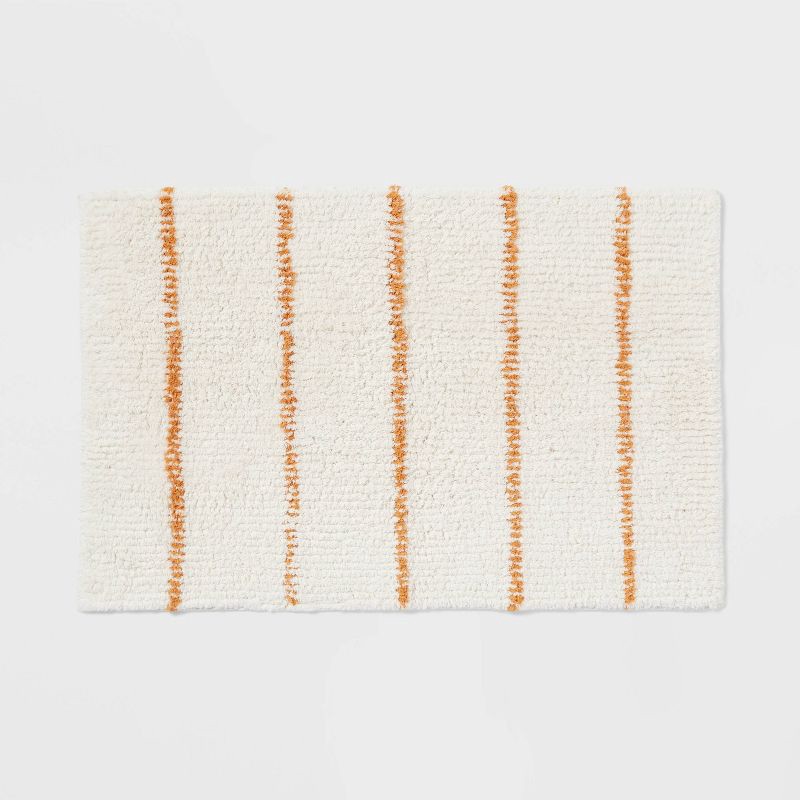 slide 1 of 4, 20"x30" Modern Tufted Stripe Bath Rug Yellow/Cream - Threshold™, 1 ct