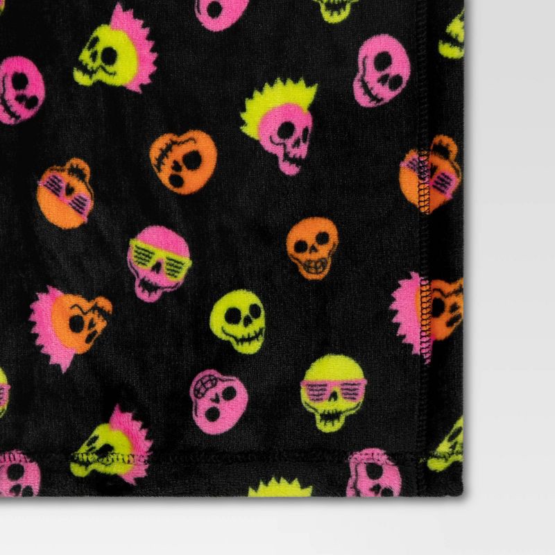 slide 4 of 4, Skull Printed Plush Halloween Throw Blanket Black - Hyde & EEK! Boutique™: Recycled Polyester, Knitted, 50x60", Machine Washable, 1 ct