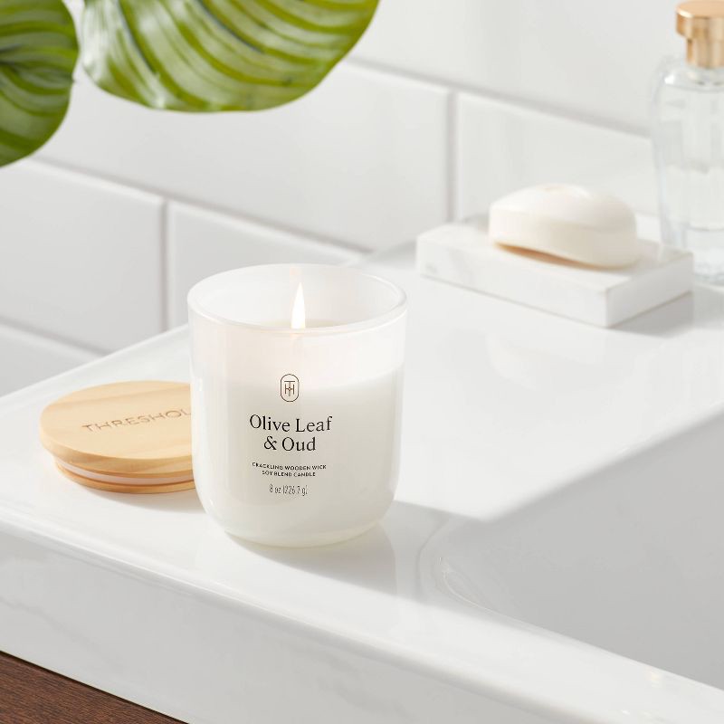 slide 2 of 3, Milky Glass Wooden Wick Olive Leaf and Oud Jar Candle 8oz - Threshold™, 8 oz