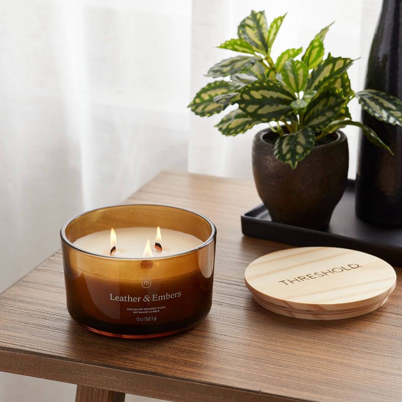 slide 2 of 3, 3-Wick Amber Glass Wooden Wick Leather and Embers Jar Candle 13oz - Threshold™, 13 oz